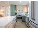 Bright kitchen features a waterfall island, stainless appliances, and modern cabinetry at 243 45Th Ne Ave, St Petersburg, FL 33703