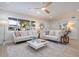 Bright living room with neutral furniture, stylish accents and a ceiling fan at 243 45Th Ne Ave, St Petersburg, FL 33703