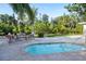 Inviting backyard oasis with a refreshing pool and comfortable seating area, perfect for outdoor relaxation and entertaining at 243 45Th Ne Ave, St Petersburg, FL 33703