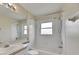 A well-lit bathroom features a tub, shower, and a neutral color scheme at 25327 Seven Rivers Cir, Land O Lakes, FL 34639