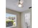 Comfortable bedroom featuring neutral walls, ceiling fan and natural light at 25327 Seven Rivers Cir, Land O Lakes, FL 34639
