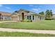 Attractive single-story home with a well-kept lawn and beautiful landscaping at 25327 Seven Rivers Cir, Land O Lakes, FL 34639