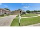 Well-maintained single-story home featuring a manicured front lawn and a classic mailbox at 25327 Seven Rivers Cir, Land O Lakes, FL 34639