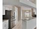 Modern kitchen featuring stainless steel appliances and a breakfast bar area at 25327 Seven Rivers Cir, Land O Lakes, FL 34639