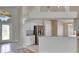 Modern kitchen and entrance featuring an island and stainless steel appliances at 25327 Seven Rivers Cir, Land O Lakes, FL 34639