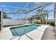 Backyard screened pool showcasing clear water and an open deck at 25327 Seven Rivers Cir, Land O Lakes, FL 34639