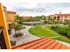 Scenic aerial view of community pool, lush landscaping, and well-maintained walking paths at 2724 Via Murano # 639, Clearwater, FL 33764