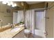 Full bathroom with shower and tub combo, single sink vanity, and a neutral color palette at 2724 Via Murano # 639, Clearwater, FL 33764