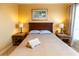 Bedroom featuring wooden furniture, bedside lamps, and neutral colors at 2724 Via Murano # 639, Clearwater, FL 33764