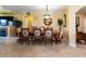 Formal dining room featuring tile flooring, a decorative mirror, and chandelier lighting at 2724 Via Murano # 639, Clearwater, FL 33764