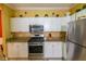 Kitchen showcasing granite countertops, stainless steel appliances, and white cabinets at 2724 Via Murano # 639, Clearwater, FL 33764