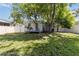 Backyard featuring patio with table and chairs, fenced yard, and large shade tree at 2834 10Th N Ave, St Petersburg, FL 33713