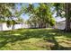 Backyard featuring a storage shed, large grassy area, trees and a full privacy fence at 2834 10Th N Ave, St Petersburg, FL 33713