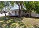 Backyard featuring patio with table and chairs, fenced yard, and mature trees at 2834 10Th N Ave, St Petersburg, FL 33713