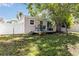 Backyard featuring patio with table and chairs, fenced yard, and trees for shade at 2834 10Th N Ave, St Petersburg, FL 33713