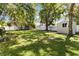 Spacious backyard features a storage shed, a large grassy area, and a privacy fence at 2834 10Th N Ave, St Petersburg, FL 33713