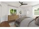 Staged bedroom featuring hardwood floors, neutral tones, and a comfortable bed setting at 2834 10Th N Ave, St Petersburg, FL 33713