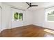 Bright, airy bedroom with hardwood floors, large windows, and a black ceiling fan at 2834 10Th N Ave, St Petersburg, FL 33713