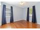 Light blue bedroom with hardwood floors and lots of natural light at 2834 10Th N Ave, St Petersburg, FL 33713