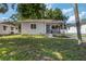 Well-kept single-story home with a front porch, landscaping, and a lush green lawn at 2834 10Th N Ave, St Petersburg, FL 33713