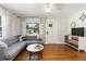 Cozy living room showcasing beautiful hardwood floors, a gray sectional sofa, and modern decor at 2834 10Th N Ave, St Petersburg, FL 33713
