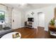 Living room showcasing hardwood floors, a gray sectional, and easy access to other rooms at 2834 10Th N Ave, St Petersburg, FL 33713
