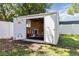 Outdoor shed with double doors wide open, revealing storage space with lawnmower inside at 2834 10Th N Ave, St Petersburg, FL 33713