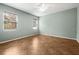 Cozy bedroom featuring two windows for natural light and tile flooring at 2950 N North Oriente Avenue N Ave, Sarasota, FL 34235