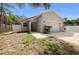 Inviting home exterior featuring manicured lawn and brick driveway leading to an attached garage at 2950 N North Oriente Avenue N Ave, Sarasota, FL 34235