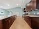 Modern kitchen features granite countertops, stainless steel appliances, and dark wood cabinets at 2950 N North Oriente Avenue N Ave, Sarasota, FL 34235