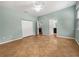 Spacious bedroom features tile flooring, a ceiling fan, and dual closets for ample storage space at 2950 N North Oriente Avenue N Ave, Sarasota, FL 34235