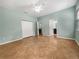 Spacious bedroom features tile flooring, a ceiling fan, and dual closets for ample storage space at 2950 N North Oriente Avenue N Ave, Sarasota, FL 34235