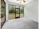 Enclosed patio with screened windows, offering a private outdoor space with views of the backyard at 2950 N North Oriente Avenue N Ave, Sarasota, FL 34235