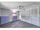 Bedroom with grey carpet, light grey walls, and a white closet with paneled doors at 3119 Roberta St, Largo, FL 33771