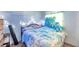 Bedroom with a bed, whimsical decorations, and a view of a window with sheer curtains at 3119 Roberta St, Largo, FL 33771