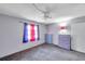 Bedroom with grey carpet, light grey walls, and an array of colorful furniture and decor at 3119 Roberta St, Largo, FL 33771