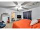 Bedroom with fan, TV, mirror, and ample natural light at 3119 Roberta St, Largo, FL 33771