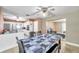 Dining room with an open layout, ceiling fan, and seamless flow into the kitchen and living area at 3119 Roberta St, Largo, FL 33771