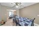 Cozy dining room with ceiling fan open to a living area creating an inviting atmosphere at 3119 Roberta St, Largo, FL 33771