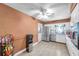 Spacious kitchen with stainless steel refrigerator, white cabinets, and an open layout at 3119 Roberta St, Largo, FL 33771