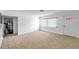 Bright living area with tile flooring, a large window, and neutral walls create a clean and inviting space at 3119 Roberta St, Largo, FL 33771