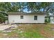 The backyard features an open space with some foliage and concrete patio at 3215 W Villa Rosa St, Tampa, FL 33611