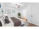 Comfortable bedroom with ceiling fan and en-suite bathroom at 3215 W Villa Rosa St, Tampa, FL 33611