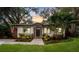Charming single-story home with well-manicured lawn at dusk at 3215 W Villa Rosa St, Tampa, FL 33611