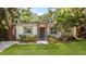 Charming single-story home featuring a well-manicured lawn and stone accents at 3215 W Villa Rosa St, Tampa, FL 33611