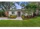 Charming single-story home with stone accents and beautifully landscaped front yard at 3215 W Villa Rosa St, Tampa, FL 33611