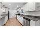 Bright, modern kitchen with granite countertops and stainless steel appliances at 3215 W Villa Rosa St, Tampa, FL 33611