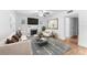 Bright living room with fireplace, ceiling fan, and stylish furniture at 3215 W Villa Rosa St, Tampa, FL 33611