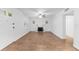 Bright living room featuring wood-look tile floors and a classic brick fireplace at 3215 W Villa Rosa St, Tampa, FL 33611