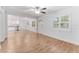 Open living room with wood-look tile floors and abundant natural light at 3215 W Villa Rosa St, Tampa, FL 33611